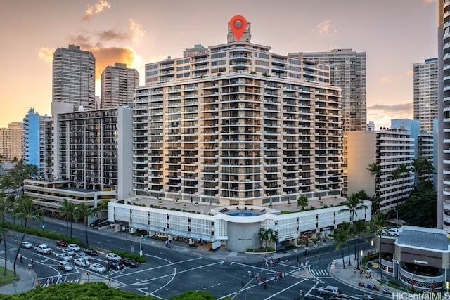 view of outdoor building at dusk