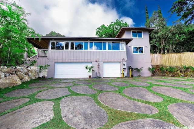 view of front of home with a garage