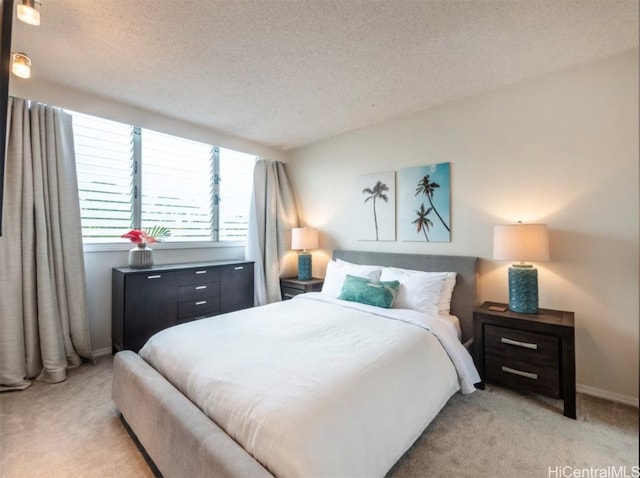 carpeted bedroom with a textured ceiling