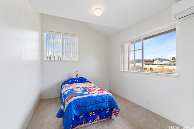 carpeted bedroom featuring a wall mounted air conditioner and vaulted ceiling