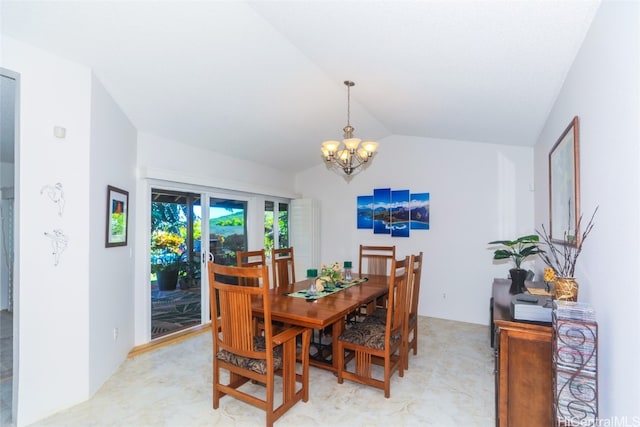 dining area featuring vaulted ceiling and a notable chandelier