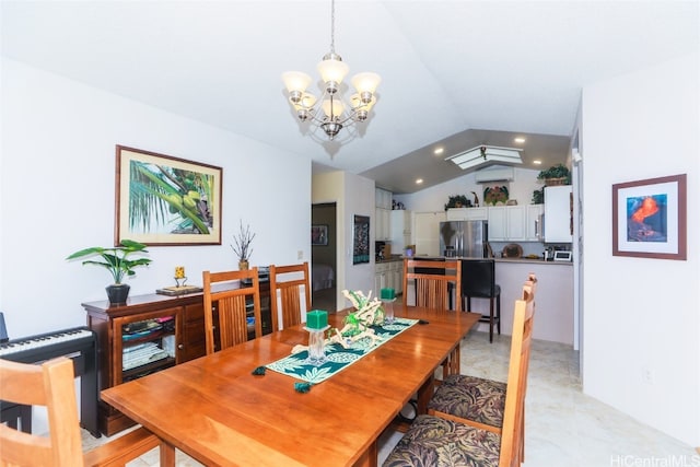 dining space with a chandelier and vaulted ceiling