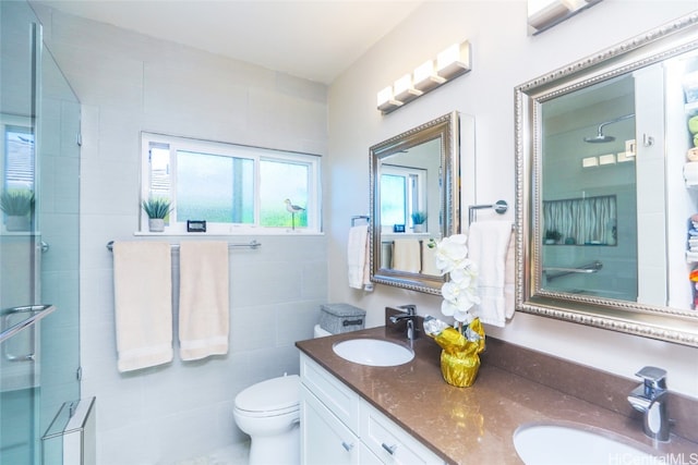 bathroom with vanity, toilet, and an enclosed shower