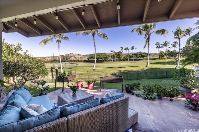 view of patio / terrace featuring an outdoor living space and a mountain view