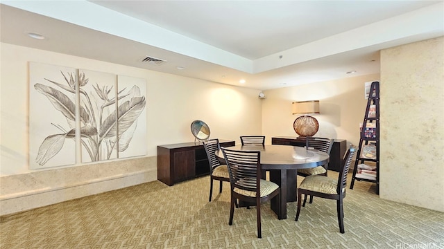 view of carpeted dining area