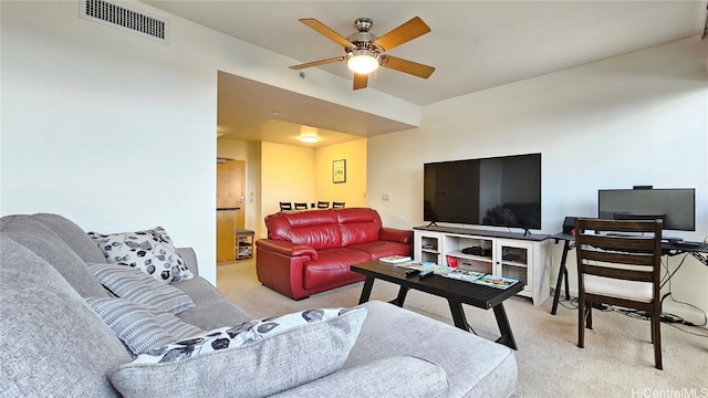 living room featuring light carpet and ceiling fan