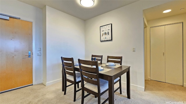 dining area with light colored carpet