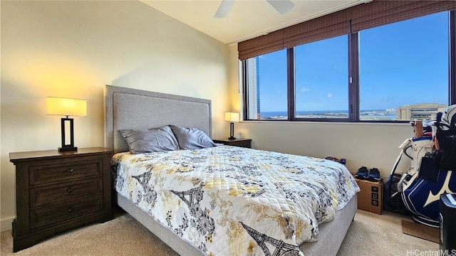 bedroom with light carpet, ceiling fan, and lofted ceiling