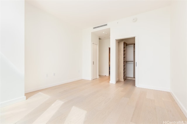 spare room featuring light hardwood / wood-style floors