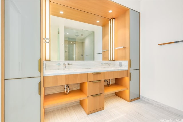 bathroom featuring vanity, hardwood / wood-style flooring, and walk in shower