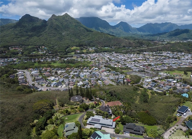 birds eye view of property with a mountain view