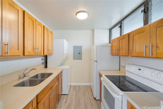 kitchen with electric panel, stacked washer and clothes dryer, white range with electric cooktop, sink, and light wood-type flooring