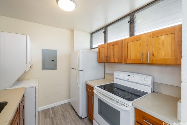 kitchen featuring backsplash, electric panel, white appliances, and light wood-type flooring