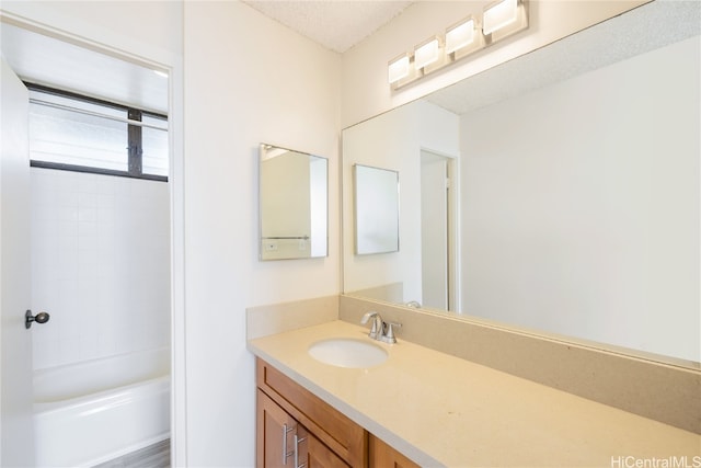 bathroom featuring vanity and shower / bath combination