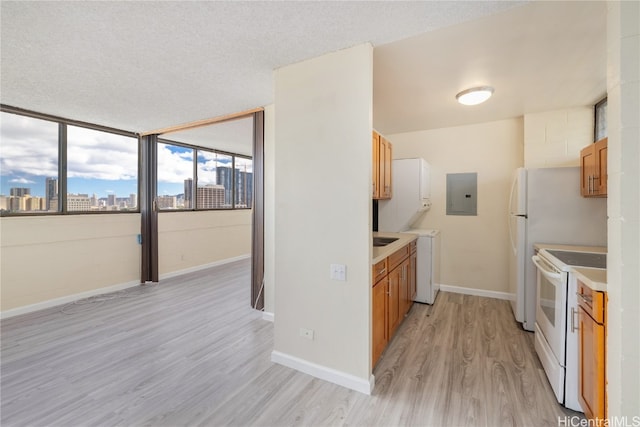 kitchen featuring electric panel, light hardwood / wood-style floors, a textured ceiling, and white electric range