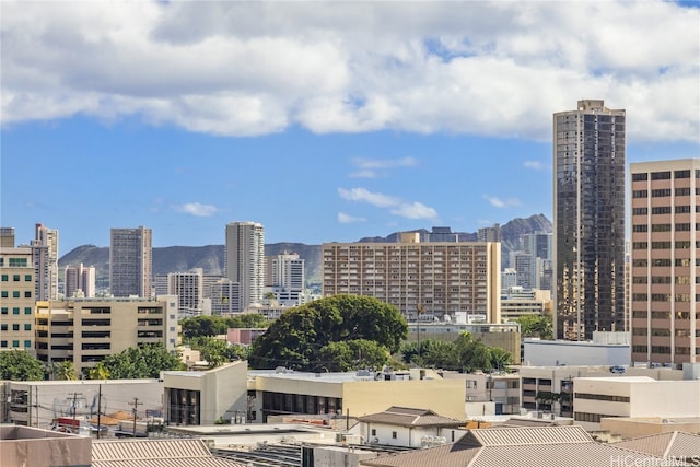 property's view of city with a mountain view