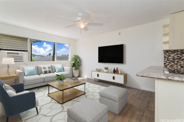 living room with hardwood / wood-style flooring, cooling unit, and ceiling fan