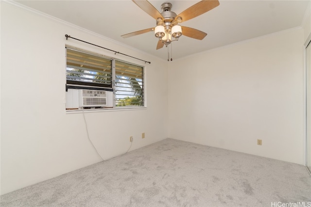 carpeted spare room with ceiling fan, cooling unit, and crown molding