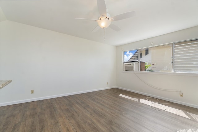 empty room featuring hardwood / wood-style floors, ceiling fan, and cooling unit