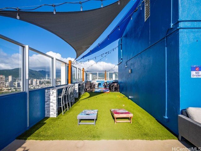 view of yard featuring exterior bar and a mountain view