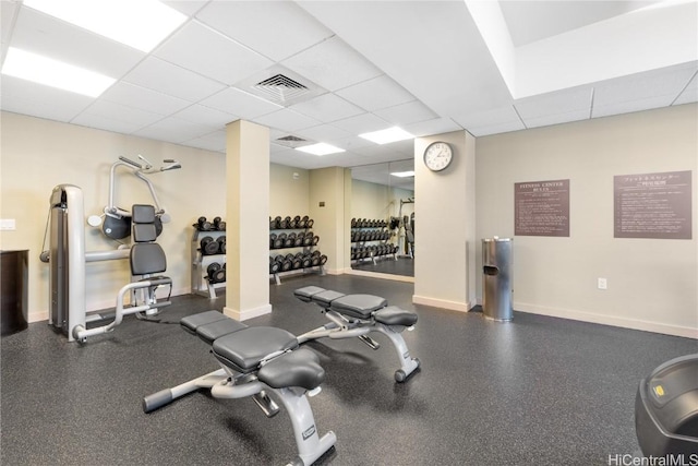 exercise room featuring a paneled ceiling