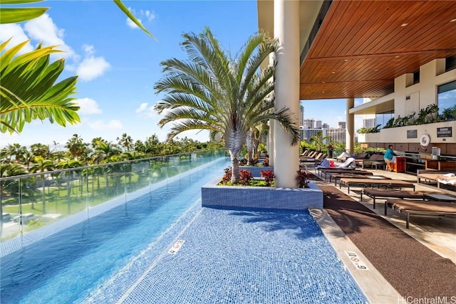 view of swimming pool featuring a water view