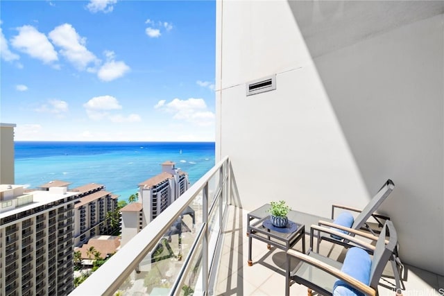 balcony featuring a water view