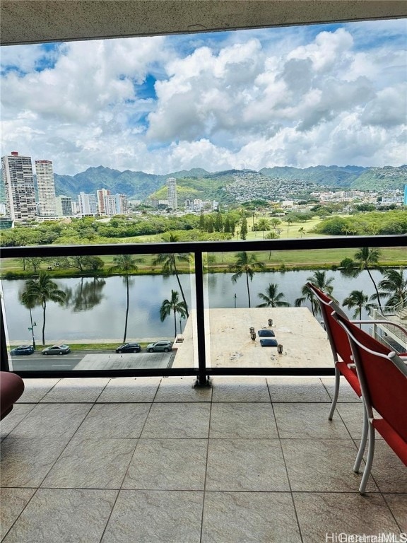 balcony with a water and mountain view