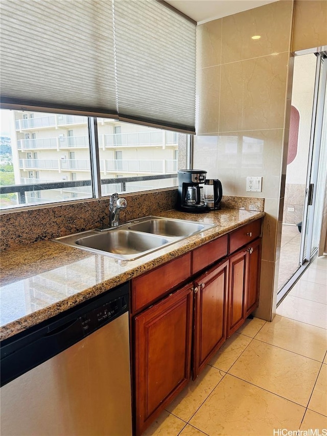444 Nahua St Unit 2211, Honolulu, HI 96815 - kitchen featuring dishwasher, a sink, light tile patterned flooring, tile walls, and light stone counters