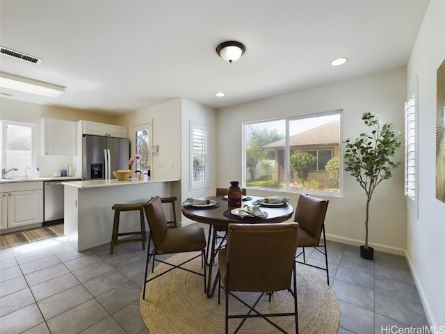 tiled dining space with sink