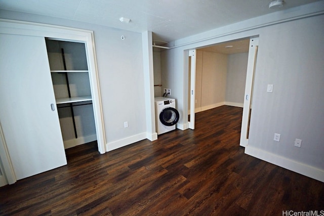 laundry area featuring dark wood-type flooring and washer / dryer