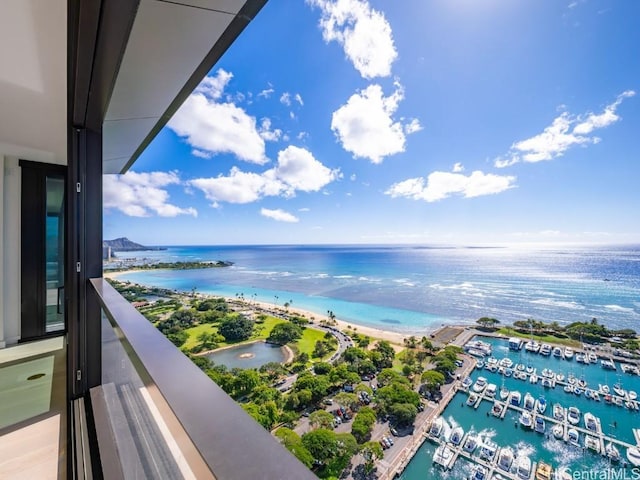 balcony with a beach view and a water view