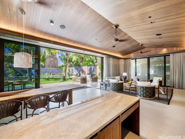 interior space featuring pendant lighting, wood ceiling, and lofted ceiling