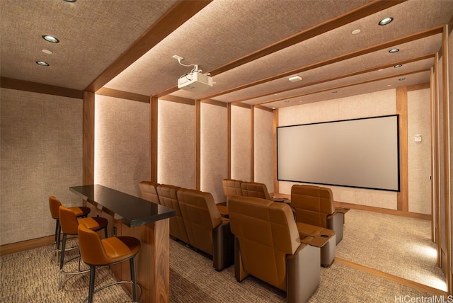 carpeted home theater room with a textured ceiling