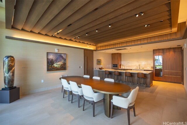 dining space featuring track lighting