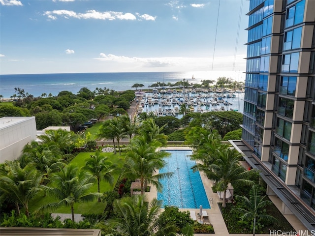 view of pool with a water view