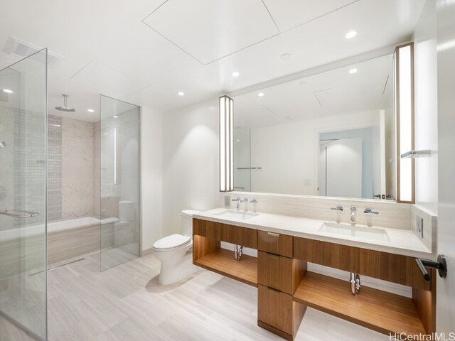 bathroom with vanity, toilet, and an enclosed shower