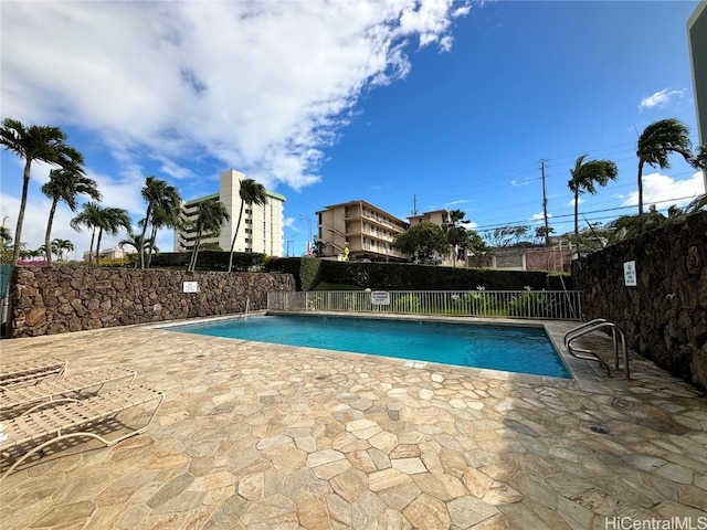 view of pool featuring a patio