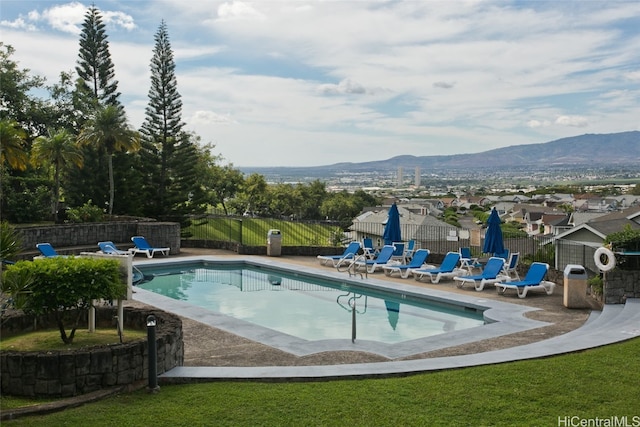 view of pool with a mountain view and a patio