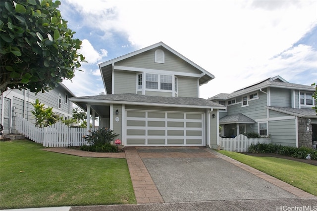 view of front facade featuring a front yard and a garage