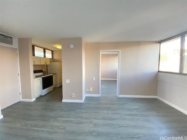 unfurnished living room featuring hardwood / wood-style flooring