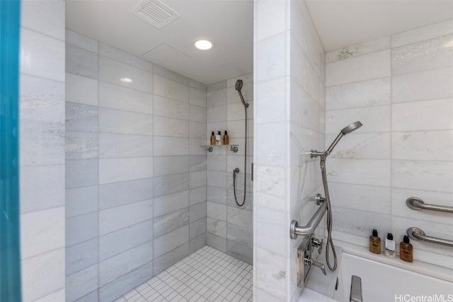 bathroom with a tile shower