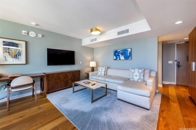 2139 Kuhio Ave Unit D2908, Honolulu, HI 96815 - living area featuring wood finished floors and a desk