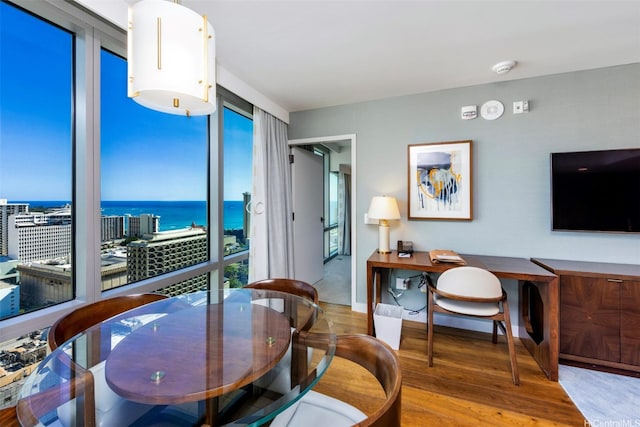 2139 Kuhio Ave Unit D2908, Honolulu, HI 96815 - dining room featuring wood finished floors and an office area