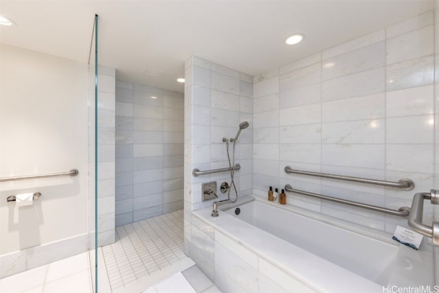 bathroom featuring tile patterned flooring and independent shower and bath