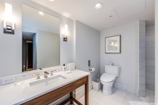 bathroom featuring tile patterned floors, vanity, and toilet