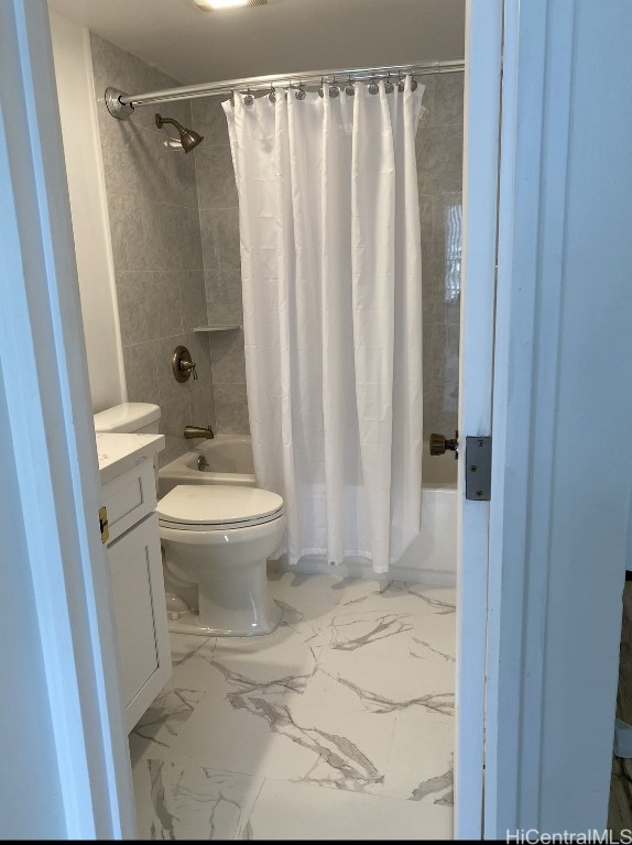 full bathroom with vanity, shower / bathtub combination with curtain, and toilet