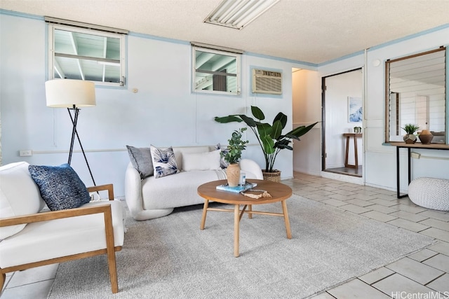 living room with light tile patterned floors, a textured ceiling, and a wall unit AC