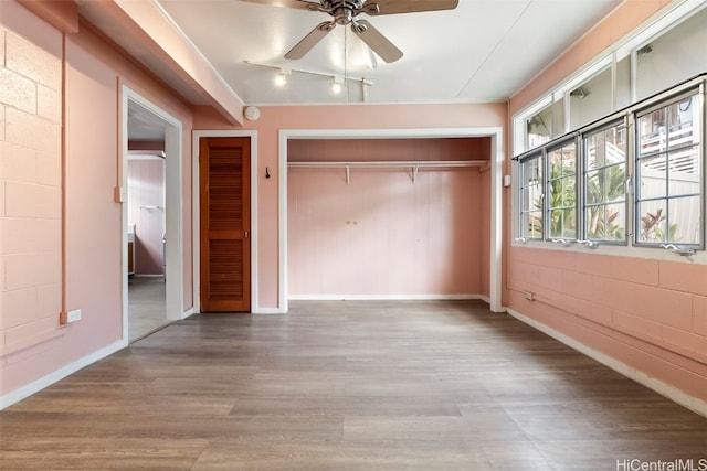 unfurnished bedroom with hardwood / wood-style floors and ceiling fan