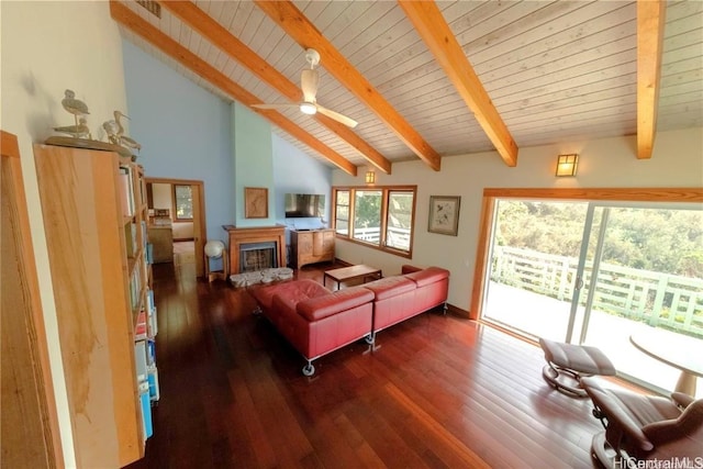 living room featuring beamed ceiling, ceiling fan, wooden ceiling, and dark wood-type flooring